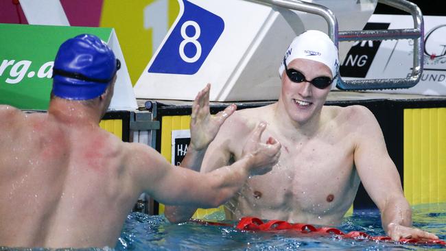 Mack Horton, right, is congratulated by Kyle Chalmers after winning the national 200m freestyle final in Brisbane last night