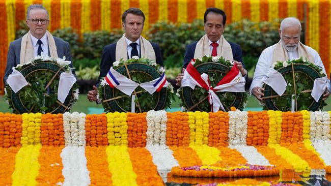 Anthony Albanese pays his respects at the Mahatma Gandhi memorial on Sunday, on the sidelines of the G20 Summit in New Delhi, with French President Emmanuel Macron, Indonesian President Joko Widodo and Indian Prime Minister Narendra Modi. Picture: AFP