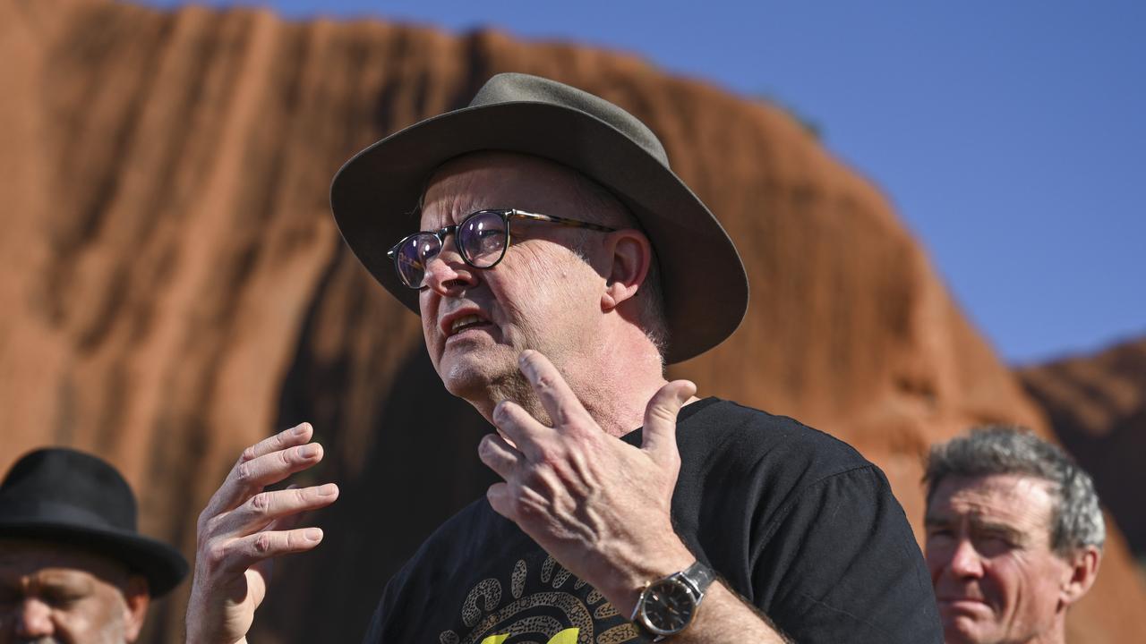 Anthony Albanese with Pat Farmer as he finished his run around the country to raise awareness about the Yes campaign in Uluru. Picture: NCA NewsWire / Martin Ollman.