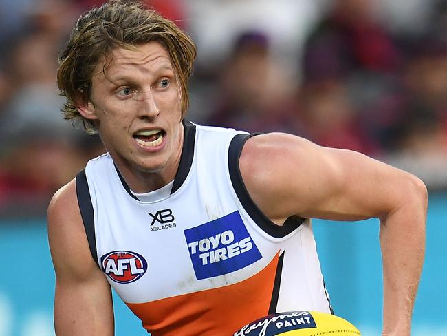 Lachie Whitfield of the Giants is seen in action during the Round 23 AFL match between the Melbourne Demons and the Greater Western Sydney (GWS) Giants at the MCG in Melbourne, Sunday, August 26, 2018. (AAP Image/Julian Smith) NO ARCHIVING, EDITORIAL USE ONLY