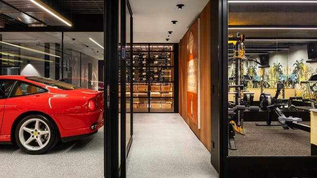 Garage meets wine cellar meets home gym in the basement.