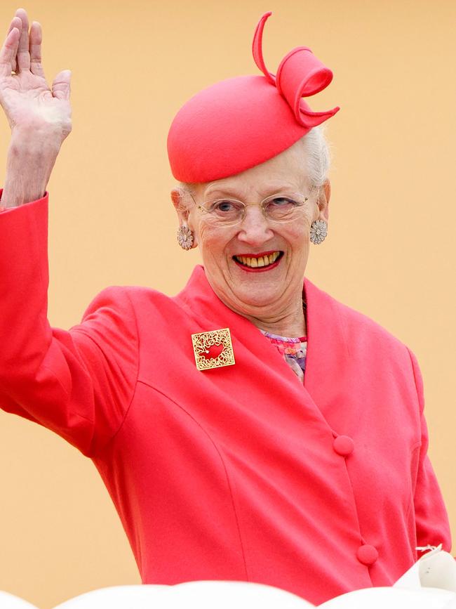 Queen Margrethe II of Denmark waves as she arrives aboard the Royal Yacht Dannebrog. Picture: AFP.