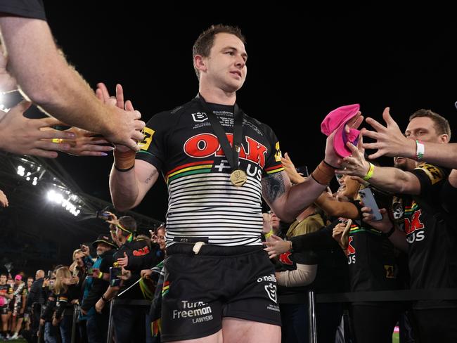 SYDNEY, AUSTRALIA - OCTOBER 02: Dylan Edwards of the Panthers high fives with fans after victory in the 2022 NRL Grand Final match between the Penrith Panthers and the Parramatta Eels at Accor Stadium on October 02, 2022, in Sydney, Australia. (Photo by Mark Kolbe/Getty Images)