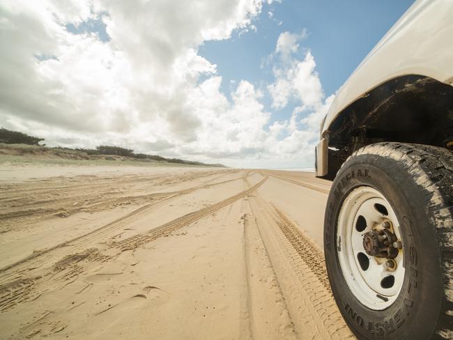 4WD BEACH STOCK -  Fraser Island, Australia - April 20, 2016: Low angle view of a 4x4 on sand on Fraser Island. Picture: Istock