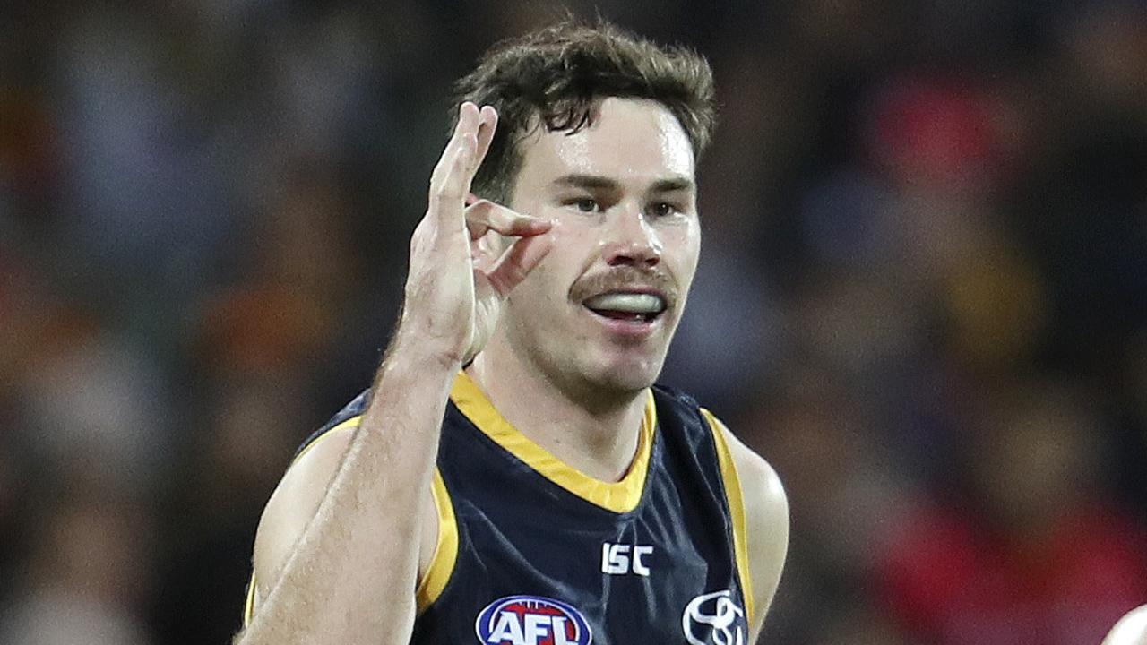 19/08/18 - AFL - Adelaide Crows v North Melbourne at the Adelaide Oval. Mitch McGovern exchanges "ok" signs with Richard Douglas after kicking his goal. Picture SARAH REED