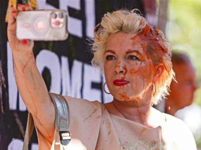 British activist Kellie-Jay Keen-Minshull aka Posie Parker is drowned out by trans-rights supporters at Albert Park where she was holding a rally. 25 March 2023