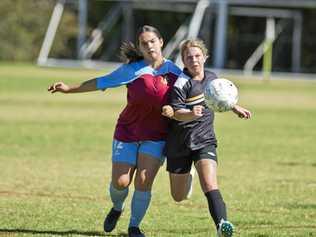 TIGHT TUSSLE: St Albans player Savannah Orcher (left) battles for possession with West Wanderers Rebecca Davis. St Albans easily accounted for Wanderers winning the game 10-0. Picture: Nev Madsen