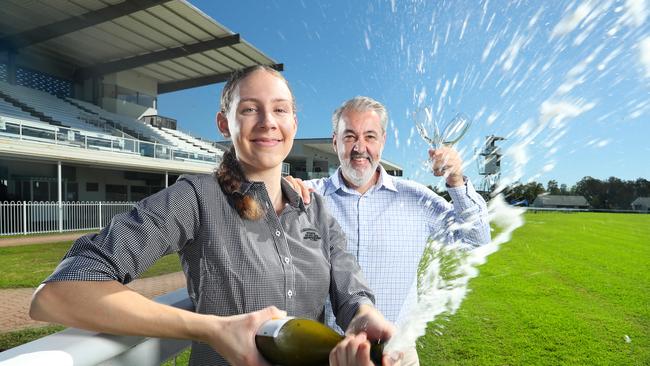 Carley Stieler, 20, Sales and Events Coordinator, with Tim Dunn, CEO Ipswich Turf Club, celebrating the return of Ipswich Cup 2021. Photographer: Liam Kidston