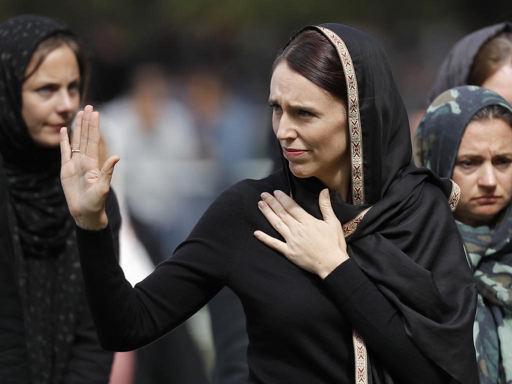 New Zealand Prime Minister Jacinda Ardern, centre, has demonstrated allegiance with the global Muslim community after the Christchurch mosque massacres. Picture: AP Photo