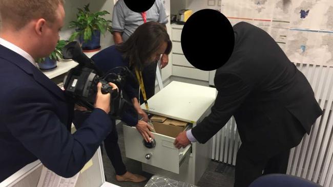 ASIO officers lock the top-secret Cabinet files in a safe at the ABC Parliament House bureau. Picture: ABC News