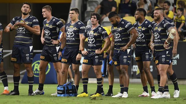 The Cowboys dejected after conceding another try. (Photo by Ian Hitchcock/Getty Images)