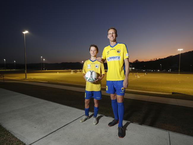 Gold Coast United's Rufus Scott, 13 with former Socceroo Michael Thwaite. Pic Tim Marsden