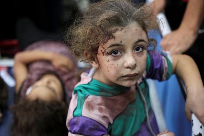 Displaced Palestinians fleeing Israeli military operations in Beit Lahia in the northern Gaza strip