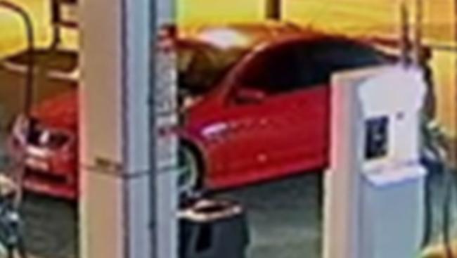 Police released CCTV images of this mid 2000s Red Holden Commodore sedan wanted in relation to the attack.