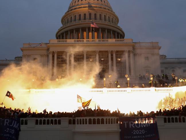 An explosion caused by a police munition is seen while supporters of U.S. President Donald Trump gather in front of the U.S. Capitol Building in Washington, U.S., January 6, 2021. REUTERS/Leah Millis