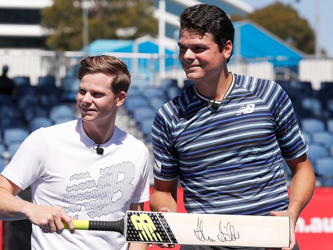 Milos Raonic (right) with Australian cricket captain Steve Smith at Melbourne Park on Thursday.