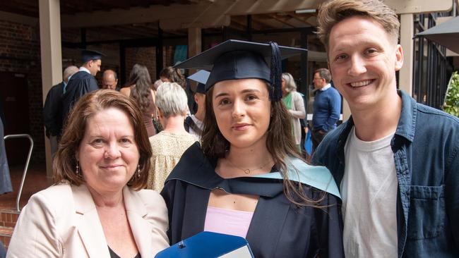 Muriel and Georgia Kennett with Seb Scott celebrate graduation. Picture: Brad Fleet