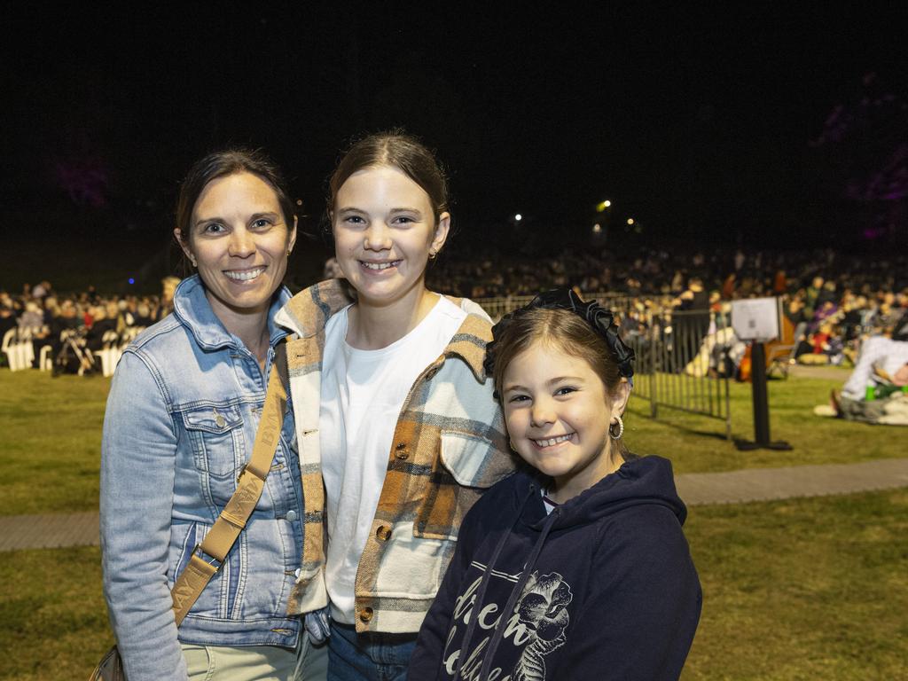 Kalah Lubbock with daughters Arya (centre) and Harper Lubbock at the Symphony Under the Stars concert performed by the Queensland Symphony Orchestra in Queens Park Amphitheatre for Carnival of Flowers, Friday, October 4, 2024. Picture: Kevin Farmer