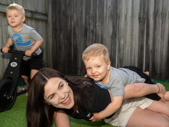 Ethan (left) and Henry Csik play with mum Kerryn in South Mackay. Picture: Michaela Harlow