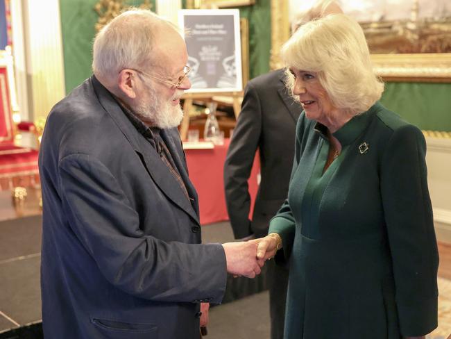 Queen Camilla shakes hands with poet Michael Longley as she attended a poetry event at Hillsborough Castle. Picture: Getty Images