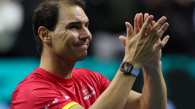 Spain's Rafael Nadal applauds during a tribute to his career at the end of the quarter-final doubles match between Netherlands and Spain during the Davis Cup Finals at the Palacio de Deportes Jose Maria Martin Carpena arena in Malaga, southern Spain, on November 19, 2024. Superstar Rafael Nadal's glittering career in professional tennis came to an end on November 19, 2024 as Netherlands eliminated Spain in the Davis Cup quarter-finals. (Photo by Thomas COEX / AFP)