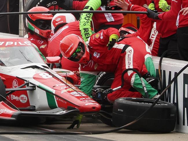 INDIANAPOLIS, INDIANA - MAY 25: Robert Shwartzman, driver of the #83 PREMA Racing Chevrolet, runs into his crew as he pits during the NTT IndyCar Series109th Running Of The Indianapolis 500 at Indianapolis Motor Speedway on May 25, 2025 in Indianapolis, Indiana. (Photo by James Gilbert/Getty Images)