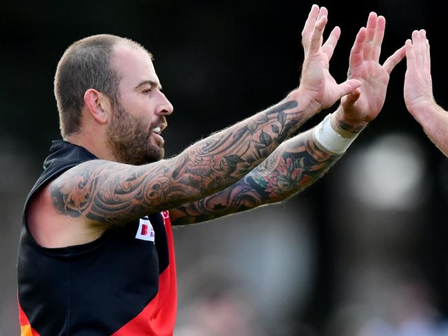 Dean Galea of Riddell is congratulated by Haydn Ross after kicking a goal during the round two RDFNL Bendigo Bank Seniors match between Riddell and Kyneton at Riddells Creek Recreation Reserve, on April 13,2024, in Diggers Rest, Australia. (Photo by Josh Chadwick)