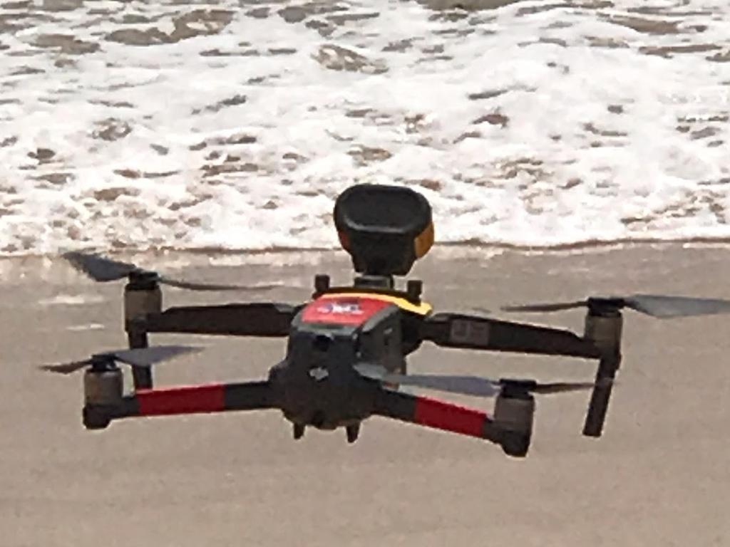 One of the drone that will used during summer to keep beachgoers and park visitor safes hovers over Manly Beach. Picture: Supplied /Northern Beaches Council