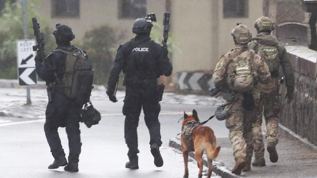 The pub has been surrounded by police. Picture: David Crosling