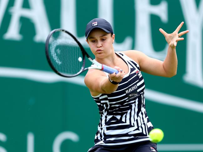 Ashleigh Barty plays a forehand during her first-round match win.