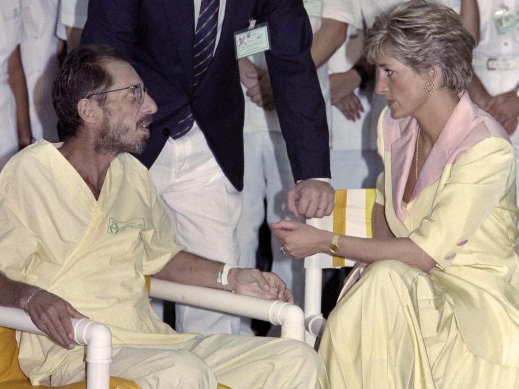 Diana talks to an HIV-positive man with AIDS. Picture: AFP PHOTO / Carlos SANTANA