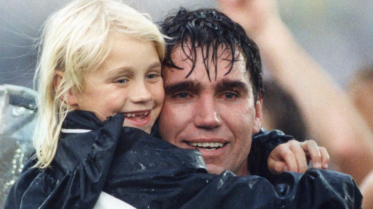 Port Adelaide’s Greg Phillips, hugged by his daughter Erin, after the 1992 SANFL Grand Final - his eighth premiership. (Pic by staff photographer Neon Martin)