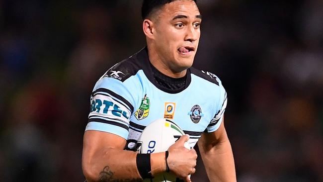 Valentine Holmes runs the ball for the Sharks.