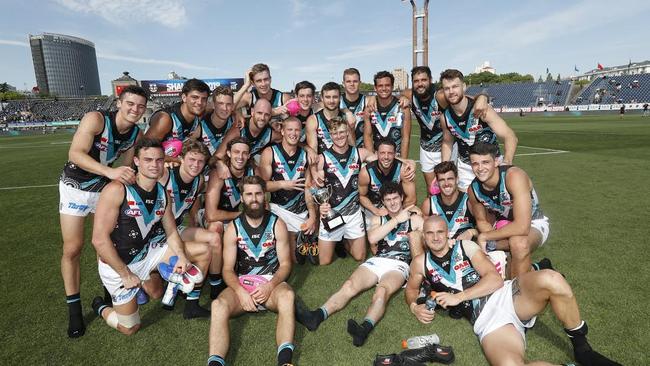 Power players after their win over St Kilda in Shanghai last year. This year’s fixture was relocated on March 4 but was a sign of more serious things to come. Picture: Michael Willson.