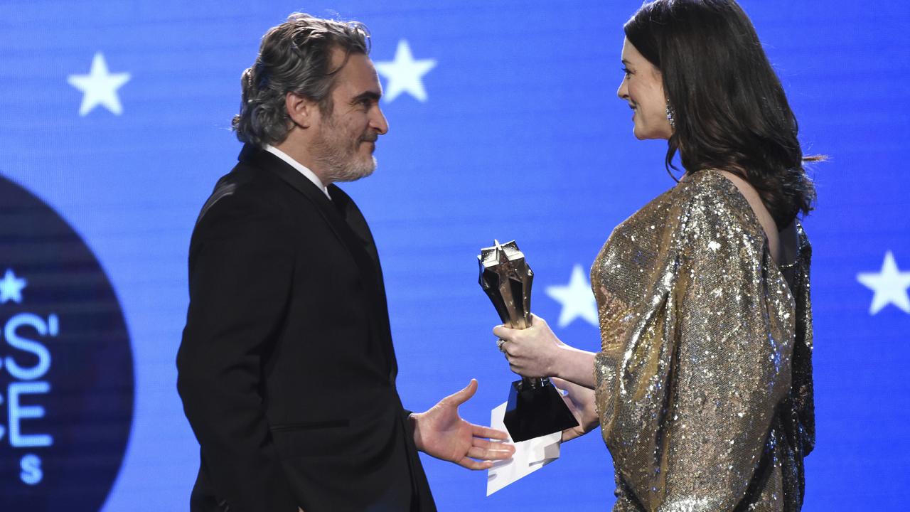 Anne Hathaway presents the award for best actor to Joaquin Phoenix for Joker. Picture: AP Photo/Chris Pizzello