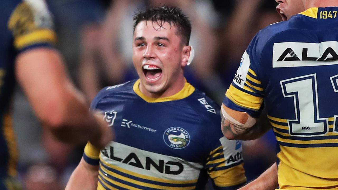 Reed Mahoney of the Eels celebrates with teammates after scoring a try to win the game at Bankwest Stadium.