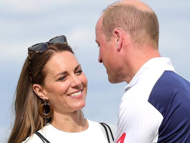 WINDSOR, ENGLAND - JULY 06: Prince William, Duke of Cambridge and Catherine, Duchess of Cambridge embrace after the Royal Charity Polo Cup 2022 at Guards Polo Club during the Outsourcing Inc. Royal Polo Cup at Guards Polo Club, Flemish Farm on July 06, 2022 in Windsor, England. (Photo by Chris Jackson/Getty Images for TLA Worldwide)