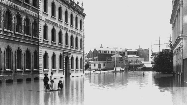 Young boys playing in floodwaters in Elizabeth Street, Brisbane, 1893.