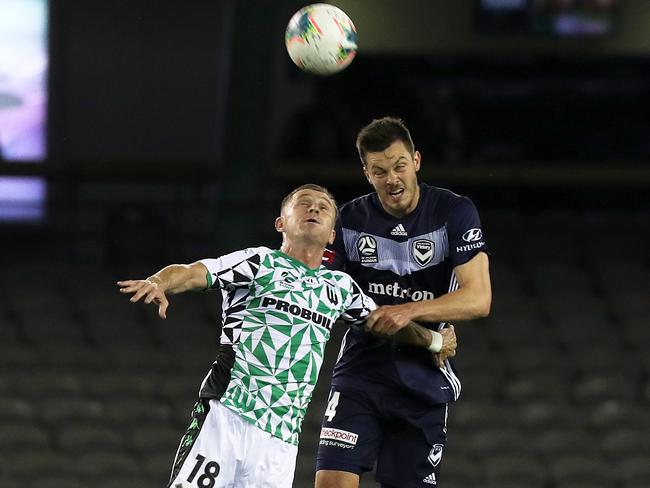 Besart Berisha battles with ex-teammate James Donachie in front of a disappointing crowd. Picture: AAP Image