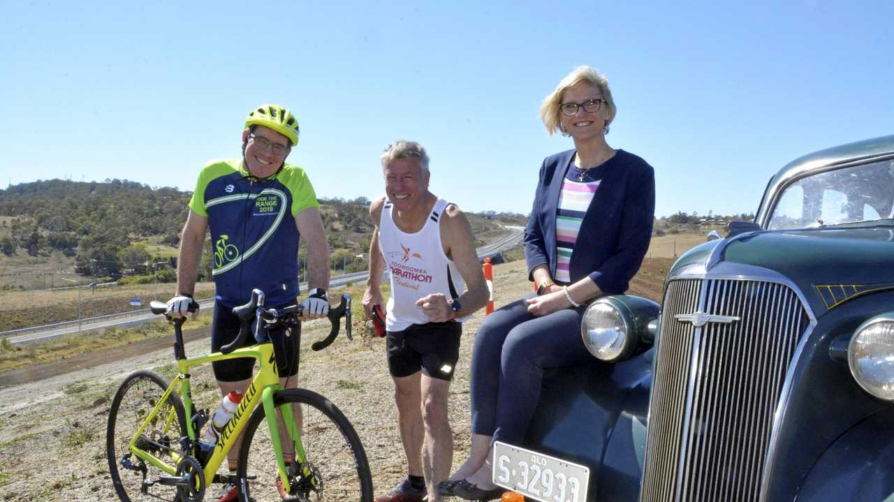 ROAD READY: Getting ready for the Toowoomba Bypass opening are (from left) Toowoomba Rotary's Mark Norman, Toowoomba Road Runners' Stephen Butterworth and Department of Transport and Main Roads regional director Kym Murphy. Picture: Tobi Loftus