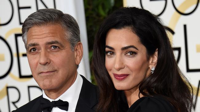 George Clooney and Amal Clooney on the red carpet for the 72nd annual Golden Globe Awards.