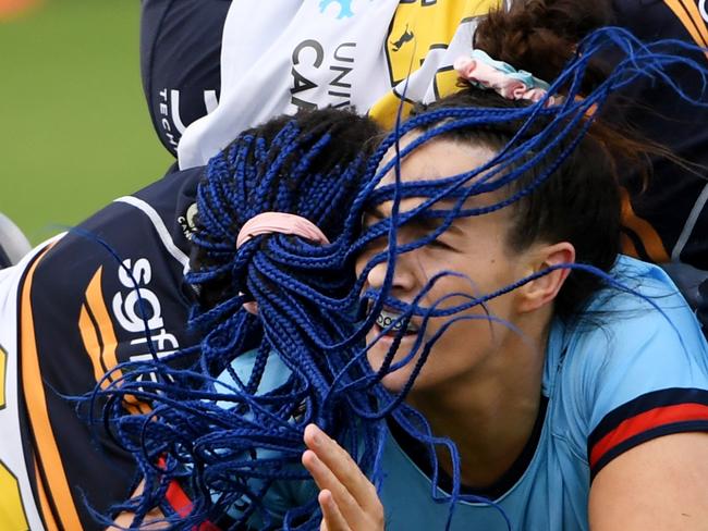 CANBERRA, AUSTRALIA - APRIL 01: Maya Stewart of the Waratahs  is tackled during the Super W match between ACT Brumbies Women and NSW Waratahs Women at GIO Stadium, on April 01, 2023, in Canberra, Australia. (Photo by Tracey Nearmy/Getty Images)