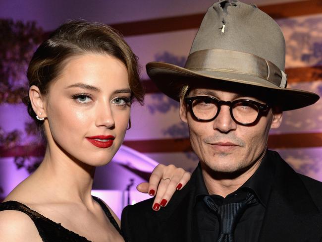 Amber Heard and Johnny Depp finalised their divorce almost eight months after their split. Picture: Michael Kovac/Getty Images for Art of Elysium