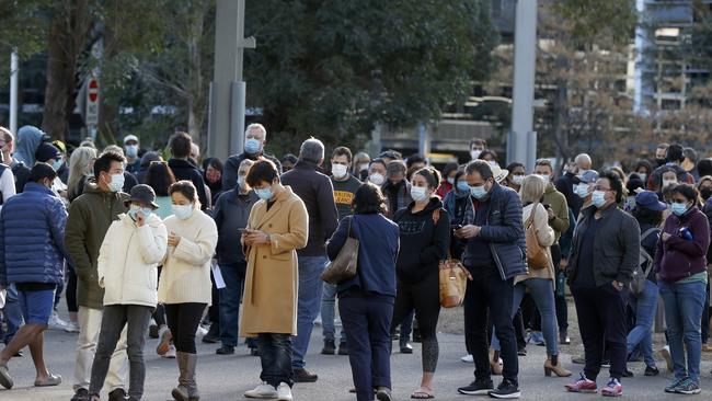 Long lines of people queue for vaccination at the NSW Health Vaccination Centre at the Sydney Olympic Park. Picture: Jonathan Ng