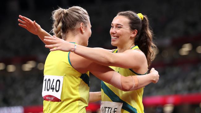 Kelsey-Lee Barber is embraced by Mackenzie Little of Team Australia after winning the bronze medal in Tokyo.