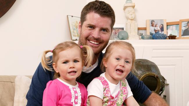 Kids at risk ... experts say Pete Evans, pictured with daughters Indii and Chilli, is hawking a cookbook for babies that includes recipe that may cause death. Picture: John Fotiadis