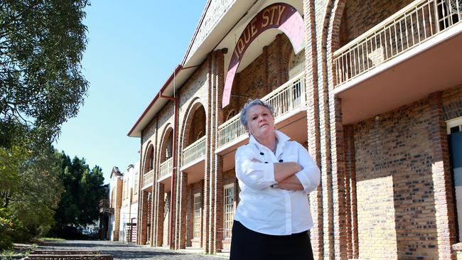 Businesswoman Jaye Rose outside the vacant Antiques building at Loganholme, which is earmarked to be bulldozed to make way for the state’s second M1. Picture: AAP/Image Sarah Marshall