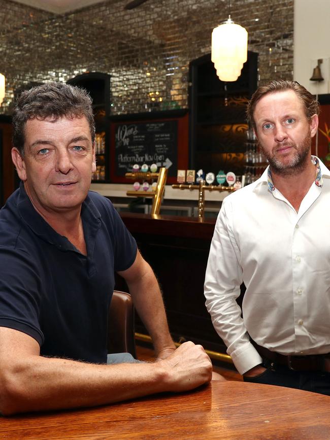 Publican Jaz Mooney and CBRE’s Paul Fraser inside the closed Grand Central Hotel in Brisbane.