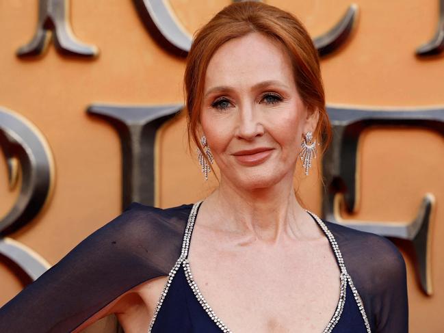 (FILES) In this file photo taken on March 29, 2022 British writer JK Rowling poses on the red carpet after arriving to attend the World Premiere of the film 