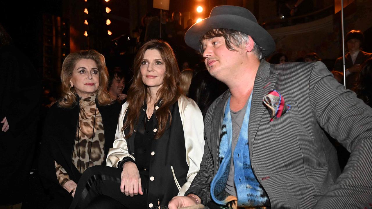 Pete Doherty, here with French actress Catherine Deneuve (L) and her daughter French actress Chiara Mastroianni (C), now lives full-time in France. Picture: AFP